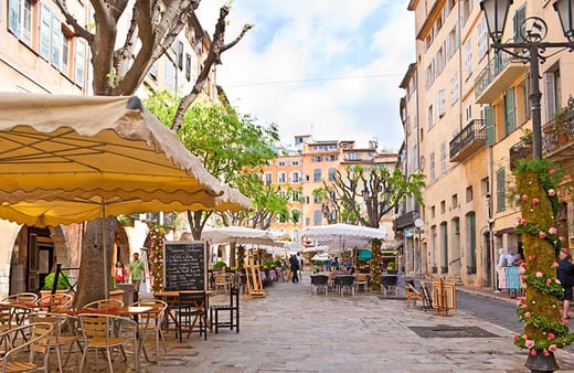 photo of a french square with bistros