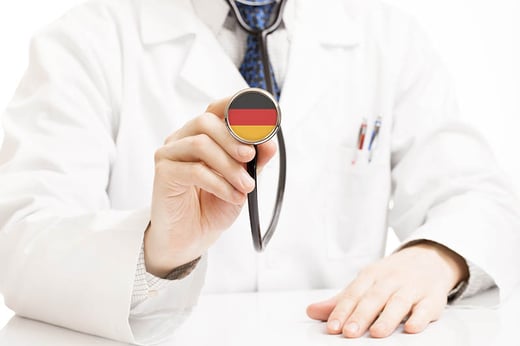 Doctor holding stethoscope with german flag imprinted