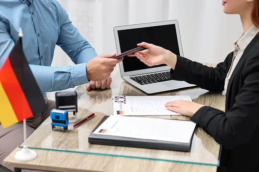 germany man giving passport 
