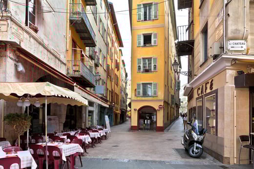 yellow building on a narrow french street 